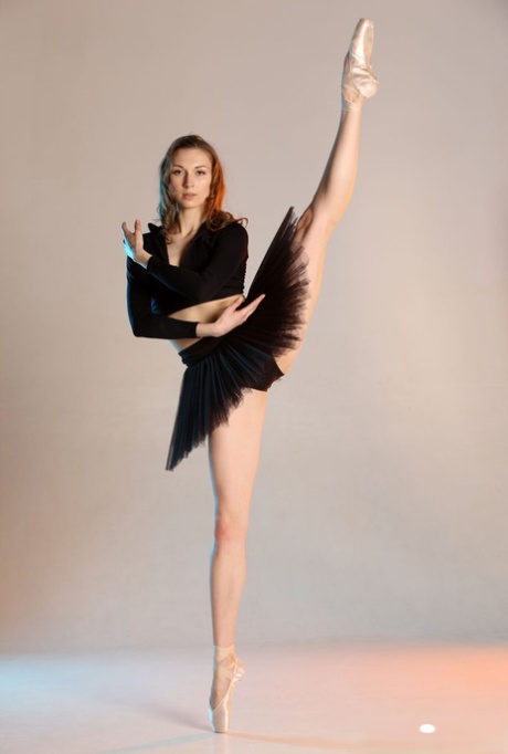 In points, Annett A, a ballerina, exposes her balding pussy while wearing a tutu and contorting her hair.