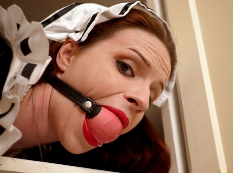 Clever maid: Caucasian maid Claire Adams is ballgagged and bound in closets.