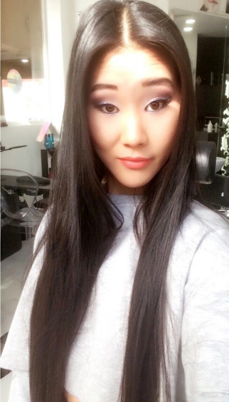 A selfie is taken by Katana, a young Asian girl, to showcase her stunning appearance and attractive skin tone.