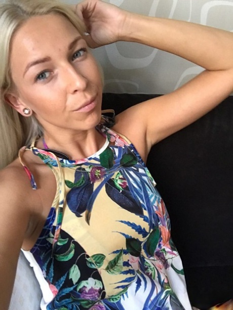 In a few outfits, an amateur blonde from Slovenia poses for some selfies while working.