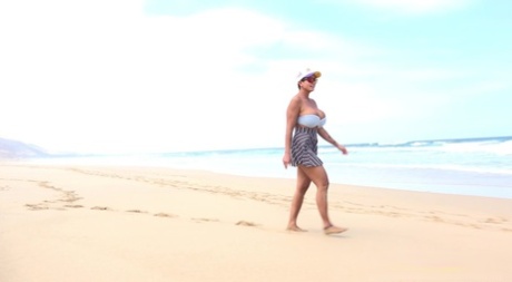 A naked woman, named Chloe falls asleep while walking on a deserted beach.