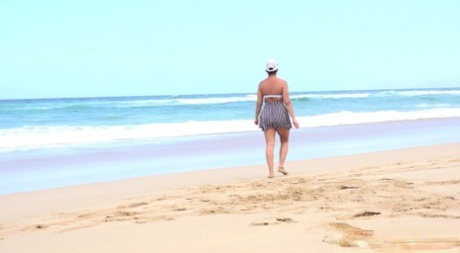 A dirty, unclothed woman named Chloe engages in sexual activity on a deserted beach.