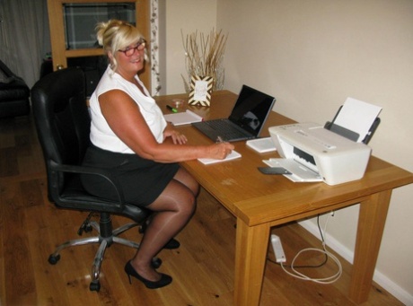 Working from her home office, blonde fatty Chrissy Uk exposes herself.