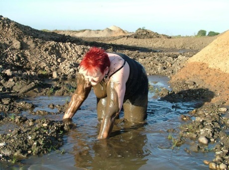 At age ten, the redhead Valgasmic Exposed is covered in mud with her excess body fat.