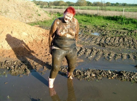 Varsity redhead Valgasmic Exposed dips into her chubby buttocks-like body in mud.