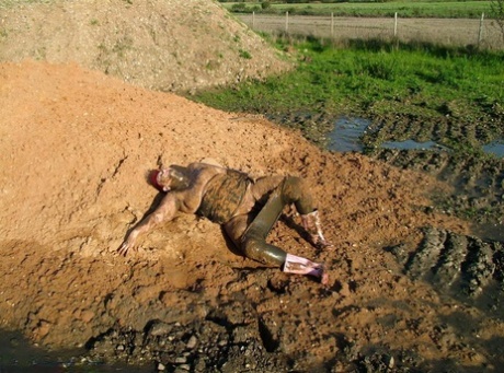 Dry hair: The bald red-headed woman by the name Valgasmic Exposed is covered in thick mud at her prime.