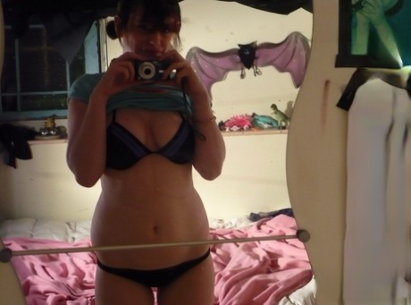 The wily amateur with a red hair sewn up in her bikini while taking selfies in front of a mirror.