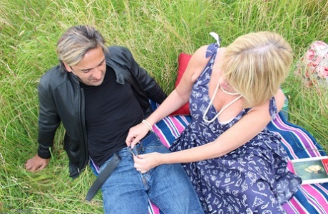 UK's older inhabitants are knocked over by a doggystyle on the blanket in front of a hay field.