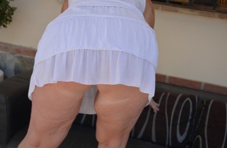 Older Blonde BBW Melody Strips To Her Underwear And Heels On Outdoor Sofa