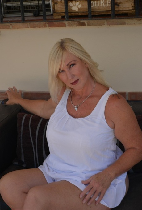 Older Blonde BBW Melody Strips To Her Underwear And Heels On Outdoor Sofa