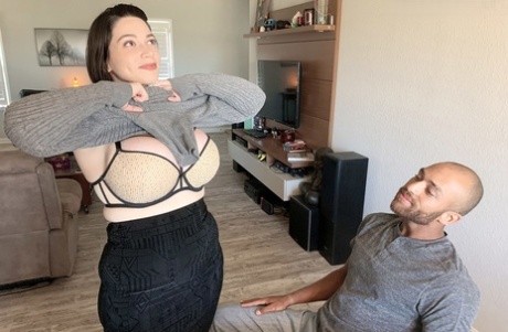 Brooklyn Springvalley releases enormous tits from a sweater on a sofa before engaging in sexual activity.