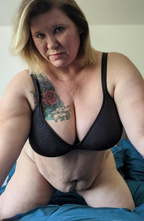 When in solo action, the older BBW Kris Ann shoots selfies with her large tits.