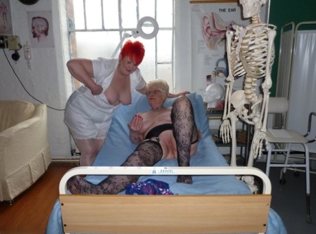 An elderly woman who appears overweight plays with a reptile while Red-headed nurse Valgasmic Exposed engages in playful play with the body.