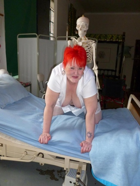 A dildo with a skeleton causes Valgasmic Exposed, an older redhead nurse, to be hit.