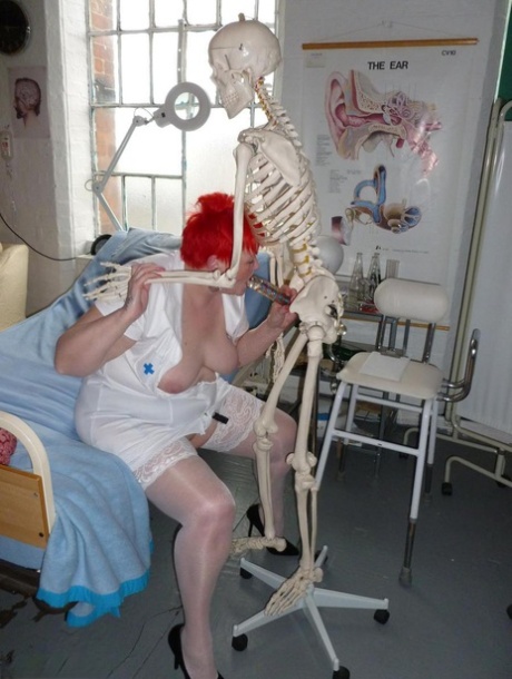 Vampir-wearing dildo and an inflatable are used to blow Valgasmic Exposed, an older redhead nurse.