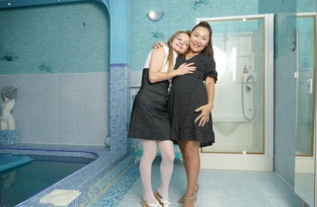 Lady Mongolia and Nelly, both amateur women, participate in interracial lesbian sex.