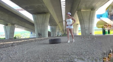 Short taken girl Chloe Lamour takes a badly needed piss underneath an overpass