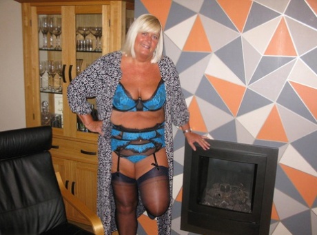 Wearing a blanket in nylons and heels, the blonde beauty Chrissy Uk goes for a nude look.