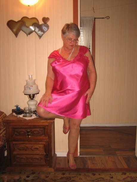 Silver Haired Nan Girdle Goddess Pulls Her Hose Down Around Her Knees On A Bed