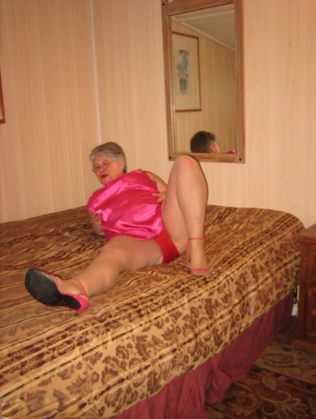 Silver Haired Nan Girdle Goddess Pulls Her Hose Down Around Her Knees On A Bed