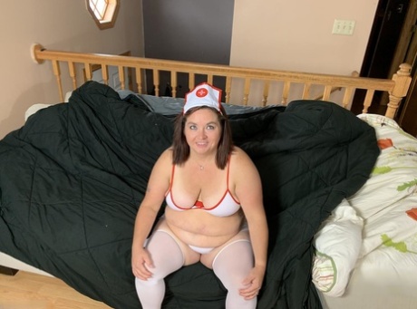 Wearing naughty nurse attire, Sexy NE BBW exposes herself as an older amateur.