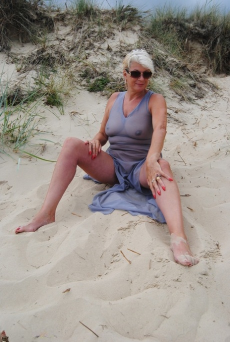 At the beach, models with blonde hair and a visible eyewear wear older models.