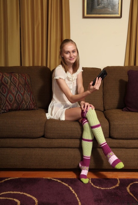 Adorable teen Alicia Williams takes a selfie before getting naked in OTK socks