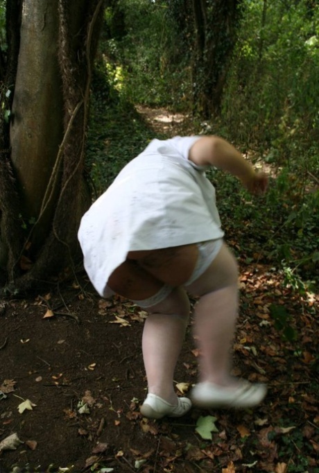 In wooded areas, Lexie Cummings takes out her big ass to show off some hefty, older blonde hair.