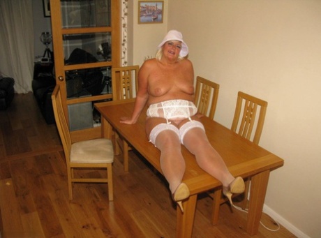 A kitchen table serves as the location for a mature blonde, where British Virgin of Wales' Chrissy Uk can release her private parts on their backs.