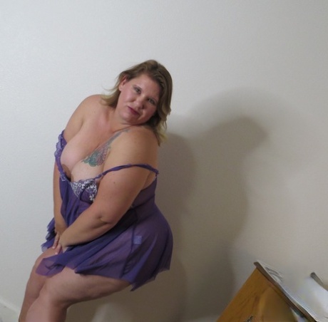 Fat amateur Busty Krisann doffs lingerie before standing naked against a wall