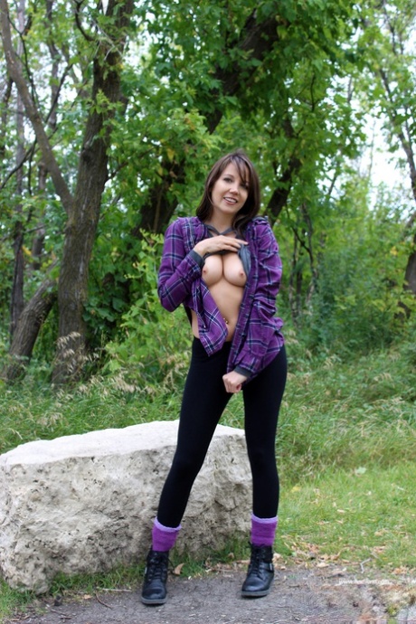 Young Amateur Andi Land Exposes Her Tight Ass On A Boulder Near The Woods