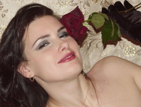 Models wearing nylon and garters and black gloves are stunning as Susy Rocks poses for photos.