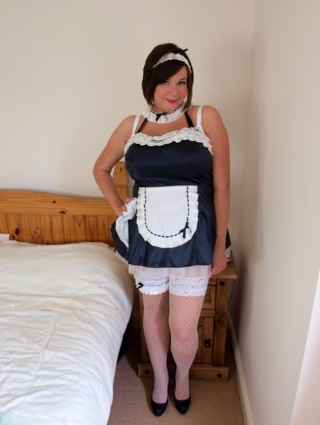 Brunette Maid Roxy Loose Her Large Breasts On A Bed While At Work