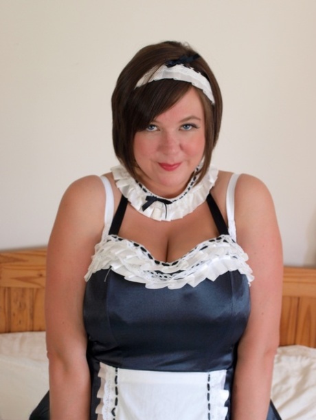 Brunette Maid Roxy Loose Her Large Breasts On A Bed While At Work