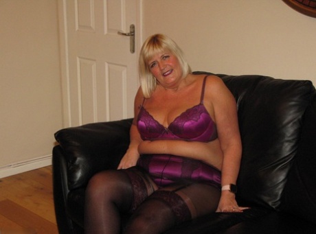 Iconic: A leather loveseat is being worn by blonde BBW Chrissy Uk who also models wearing pantyhose and lingerie.