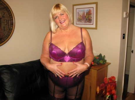 Before tearing her panty open and leaving, BBW Chrissy Uk goes topless as a mature blonde.