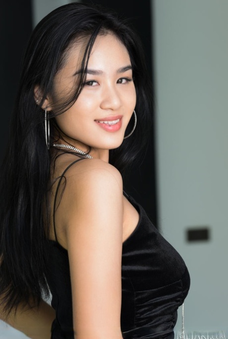 Asian teen Kahlisa sets her hot body free of a black dress during a solo gig