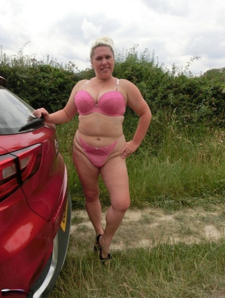 In an area with rural surroundings, Barby shows off her overweight body as a blonde amateur.
