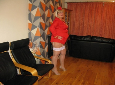 As she loosened her clothes, blonde BBW Chrissy Uk's work outfit is marred with loose tits and pussy.