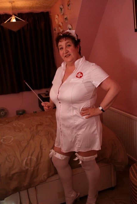 Young amateur Kinky Carol climbs over the man while wearing a nurse costume.