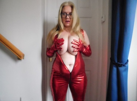 The UK's Lily May, an amateur with long blonde hair, releases her big mature breasts and pussy.