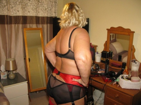 The blonde, fatty Chrissy Uk, who is older than she is in her bedroom, places her labia lips on a chair.