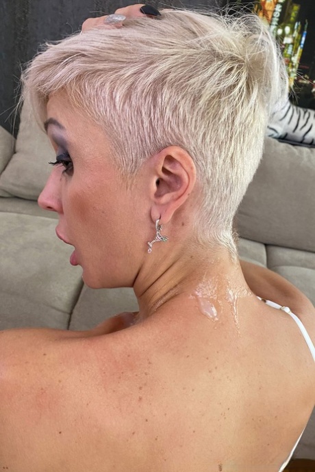 Inked Platinum Blonde Tanya Virago Holds A Cock After Showing Her Pierced Cunt