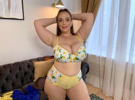 During the modelling session, model BBW Mia Sweetheart displays her lingerie and then spreads lotion over her ample tits.
