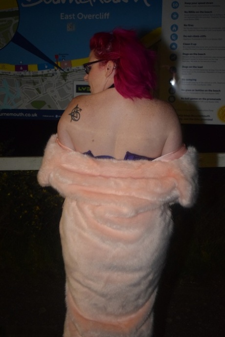 In her fur coat at night, Mollie Foxxx, a redheaded amateur, flashes.