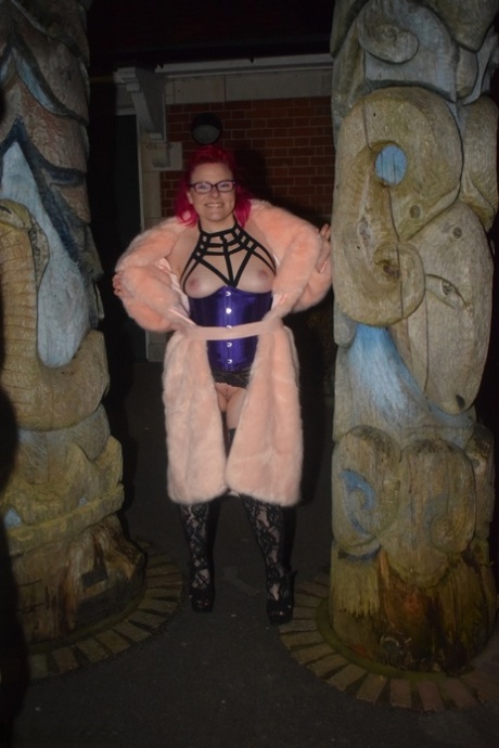 Mollie Foxxx, the red-headed amateur with a long coat, flashes at night.