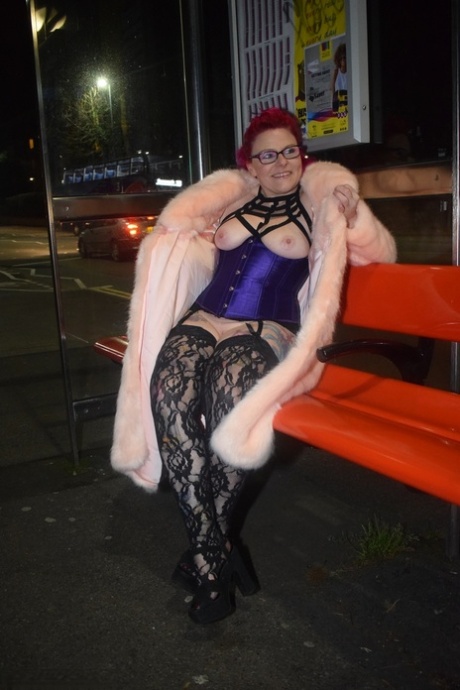 At nightfall, Mollie Foxxx is seen flashing red in a long coat.