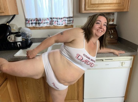 BBW Who Is Sexy Nebbw, is in her midlife and exhibits her large tits and buttocks in a kitchen.