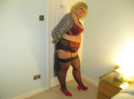 After going topless, a mature BBW Chrissy Uk slides down sheer panties.