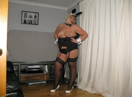 As she frees herself from her cocktail waitress costume, Chrissy Uk is filmed on camera as she releases her short hair and pussy.